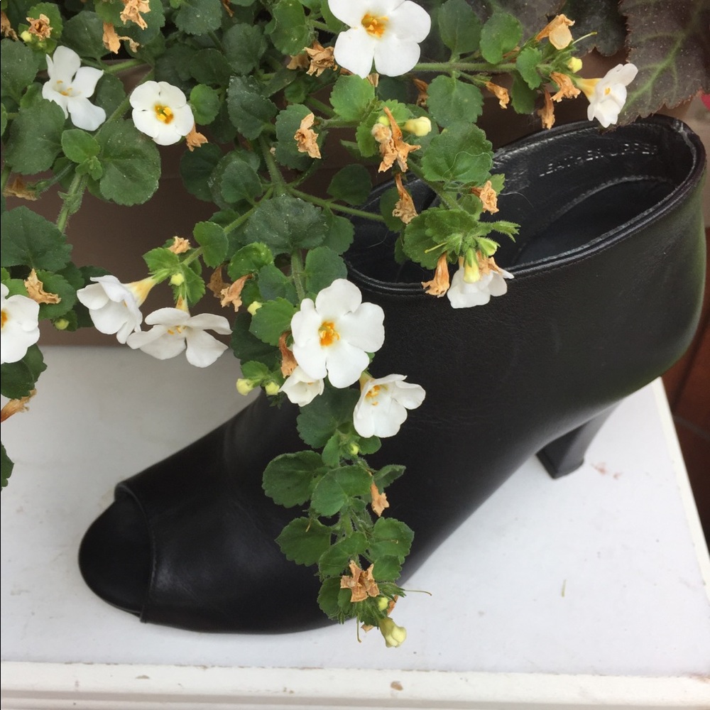 Black leather open toe bootie.